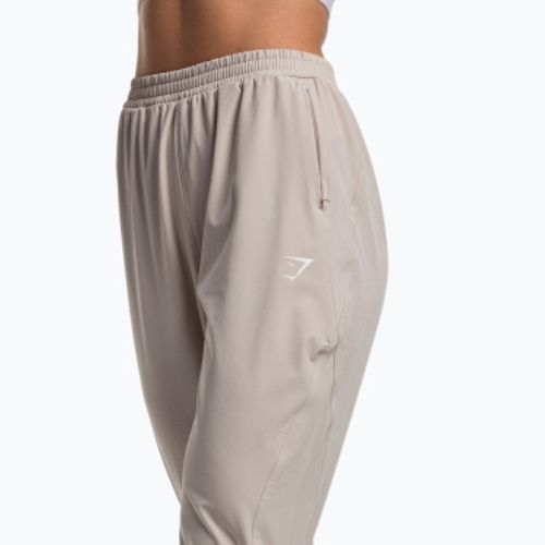 Pantaloni de trening pentru femei Gymshark Maximise Track de culoare gri pietriș