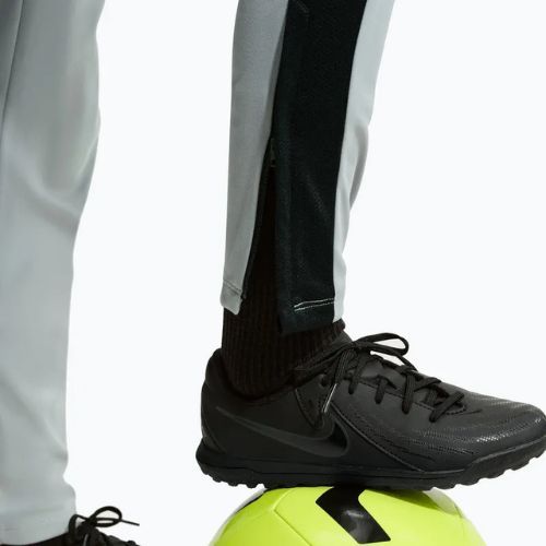 Pantaloni pentru copii Nike Academy Dri-Fit Jr light smoke grey/white/black/metallic gold
