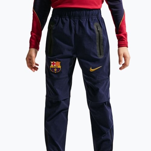 Pantaloni de fotbal pentru copii Nike FC Barcelona Tech Woven blackened blue/black/mineral yellow