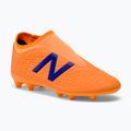 Ghete de fotbal pentru copii New Balance Tekela V3+ Magique FG portocaliu JST3FD35.M.045