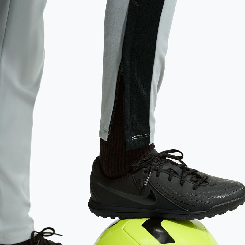 Pantaloni pentru copii Nike Academy Dri-Fit Jr light smoke grey/white/black/metallic gold 7