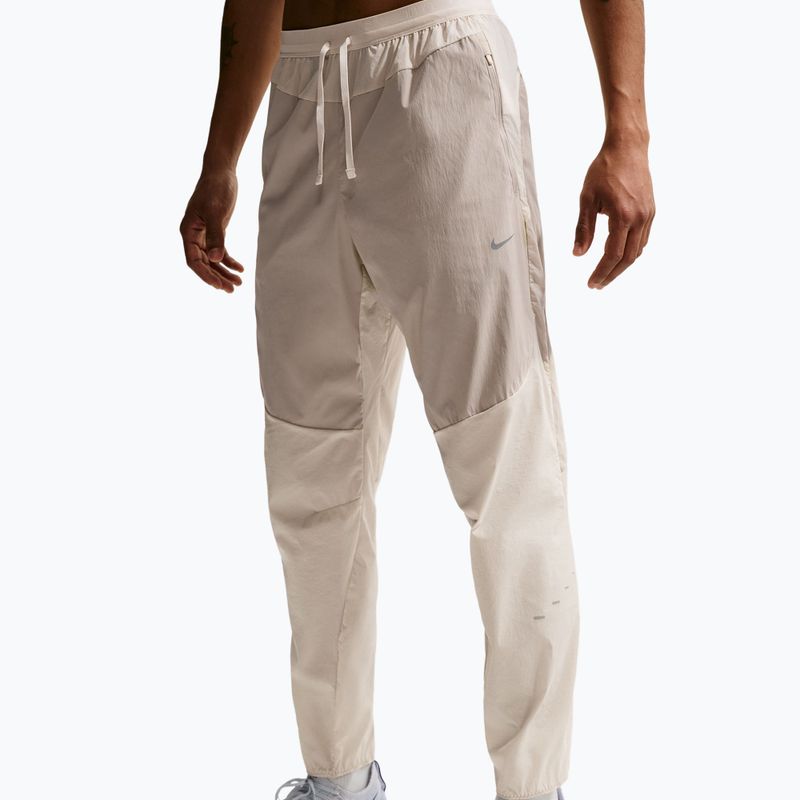 Pantaloni de alergare pentru bărbați Nike Stride Repel Woven cream li/birch/natural 4