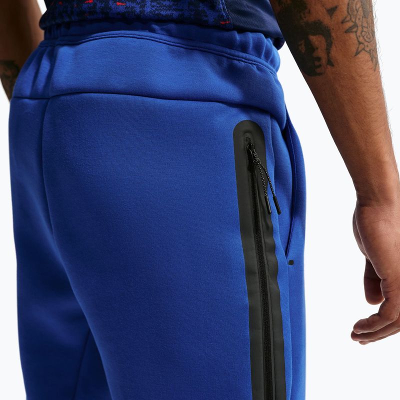 Pantaloni de fotbal pentru bărbați Nike FFF Tech Fleece Joggers game royal/metallic copper 5