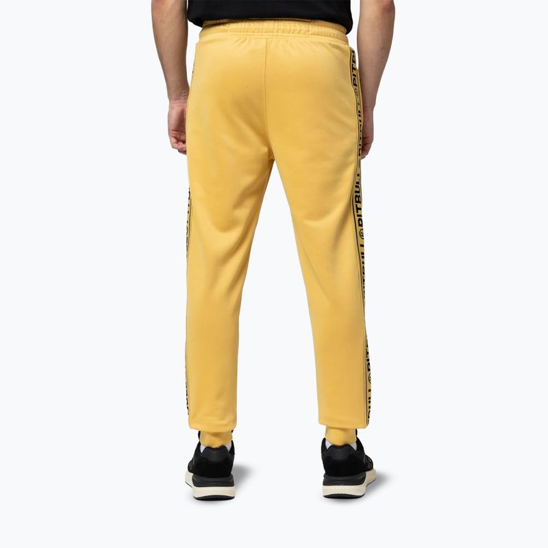 Pantaloni pentru bărbați Pitbull Trackpants Tape Logo Terry Group pale yellow 3
