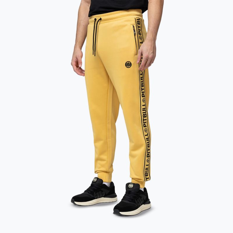 Pantaloni pentru bărbați Pitbull Trackpants Tape Logo Terry Group pale yellow 4