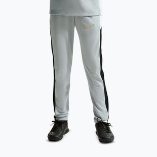 Pantaloni pentru copii Nike Academy Dri-Fit Jr light smoke grey/white/black/metallic gold